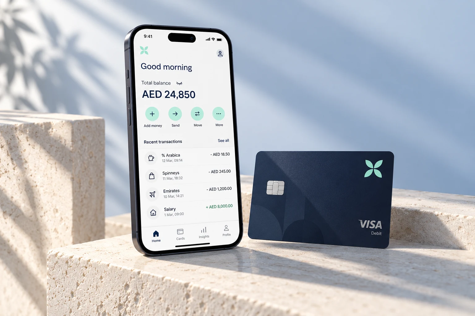 Mobile banking app showing an AED account balance beside a navy contactless debit card